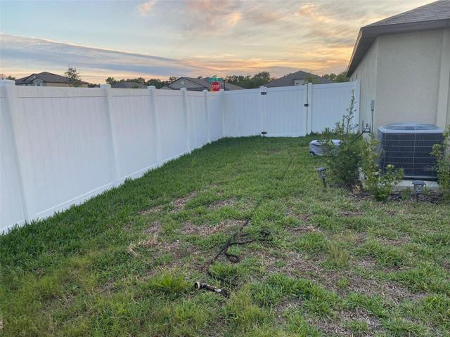 Fenced yard gives security to family and pets.