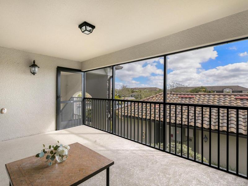 Entrance into condo with private screened in patio, facing East so perfect for am coffee and watching sun rise