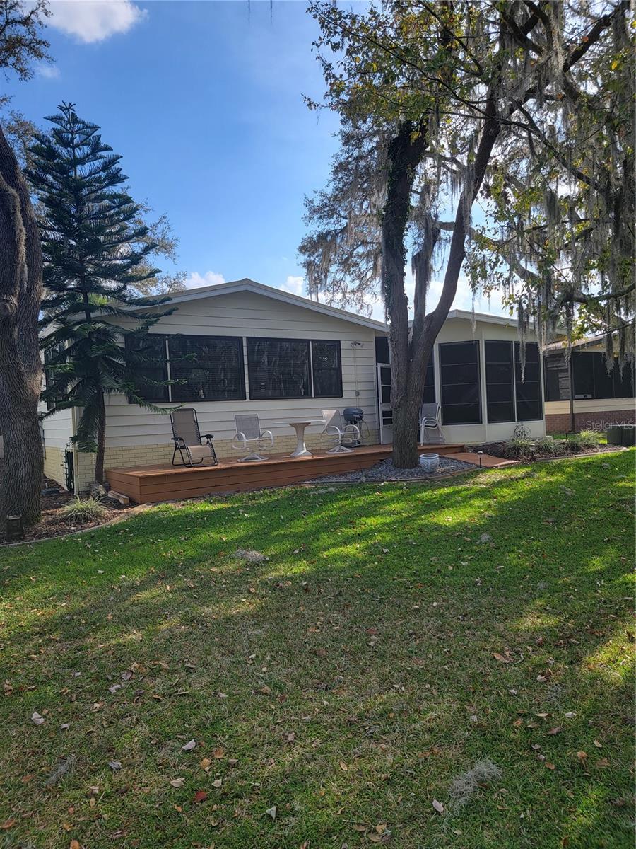 Back of the house - Family room, patio and lanai all give you a park-like golf view.