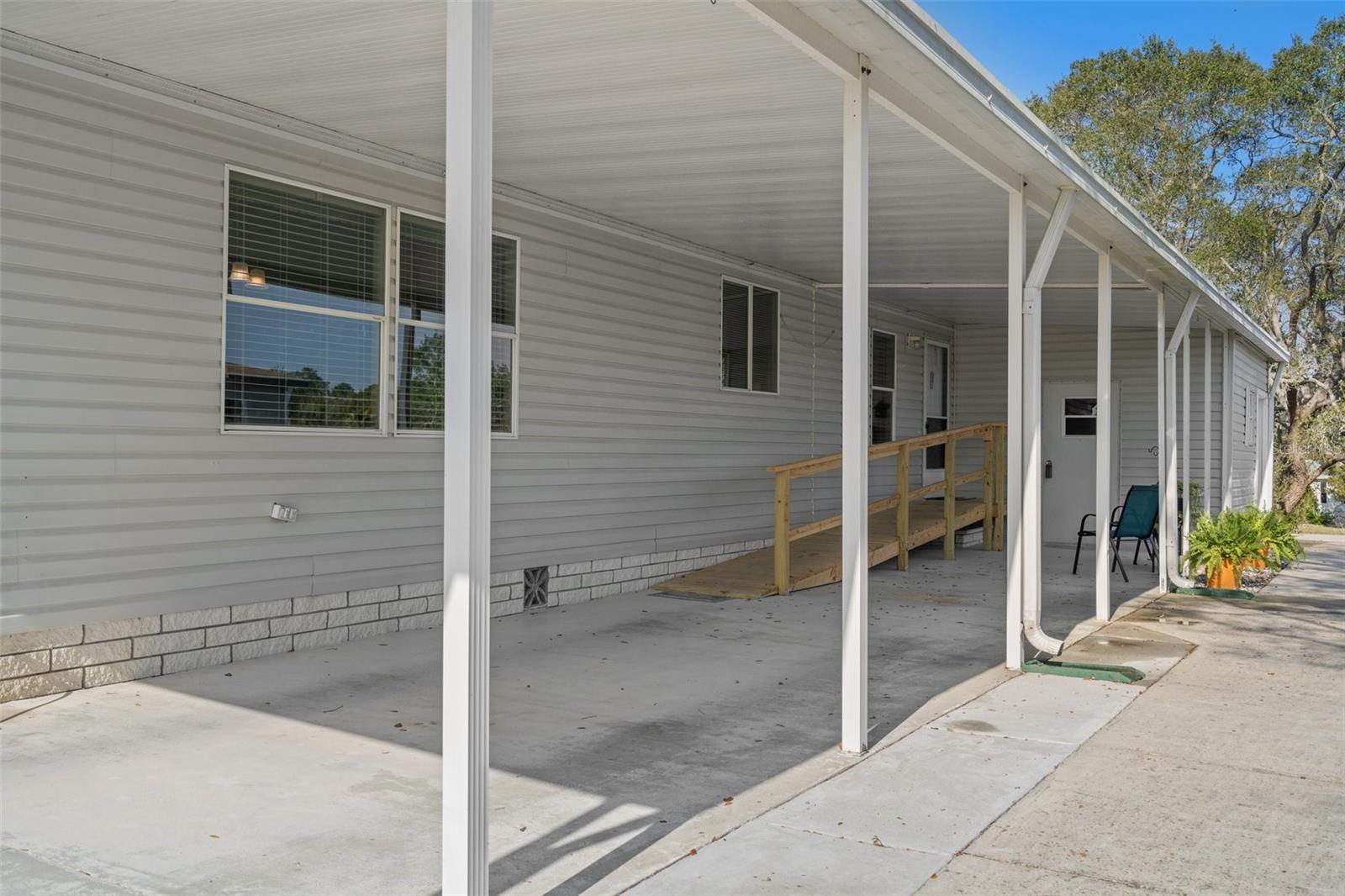 Very nice carport and shop and golf cart garage.
