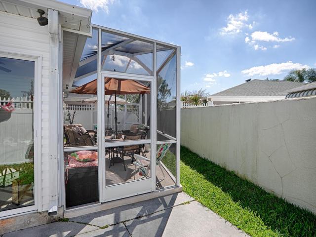 An outside view of the backyard and birdcage