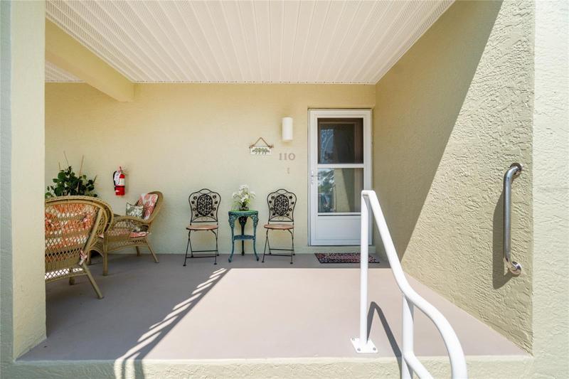 Cute little front porch to sit and sip your morning coffee. 
