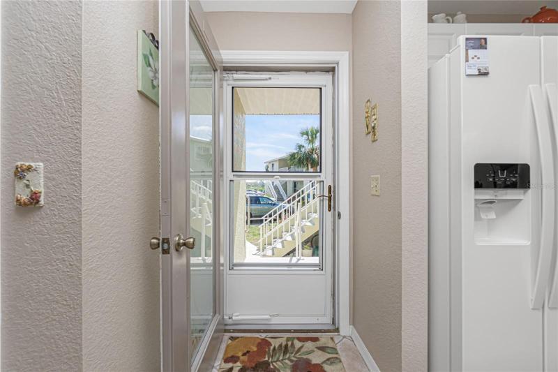 The front entry has a beautiful glass/screen door.