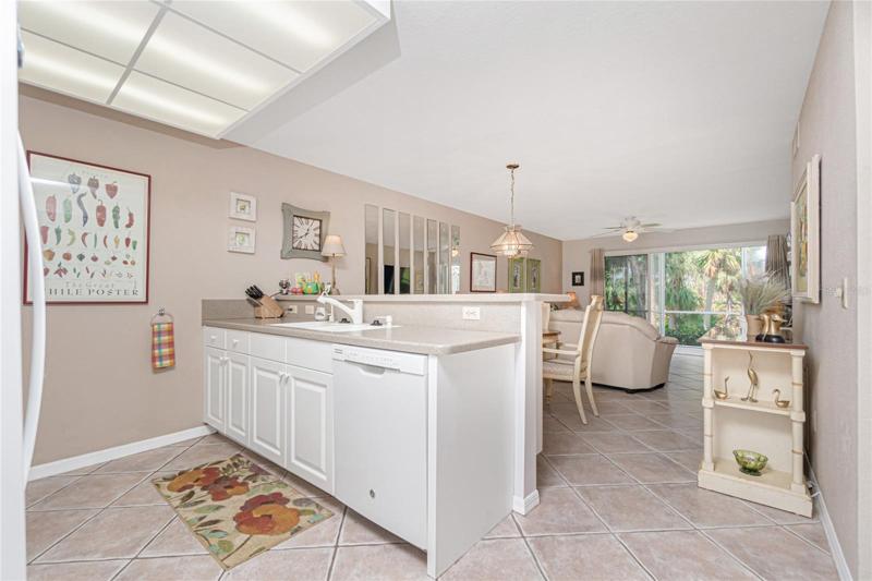 Once you enter the condo you will notice the tiled flooring throughout the main living area and a beautiful view out the back sliding glass doors.
