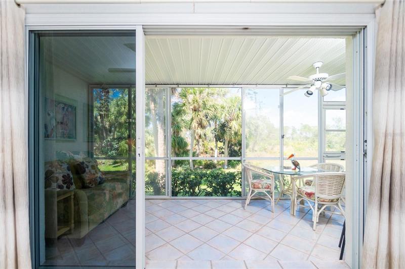 The screened and vinyl enclosed rear lanai is the perfect spot to enjoy the tropical views all year round!