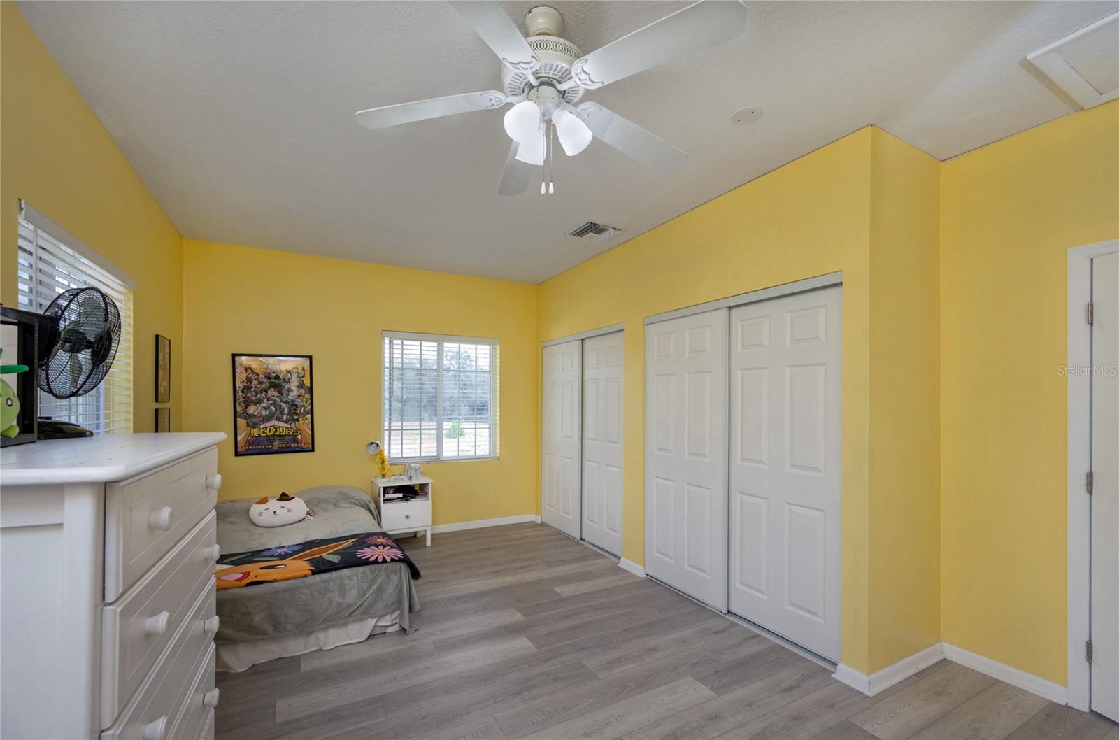 Bedroom in the addition over the garage has a large closet.