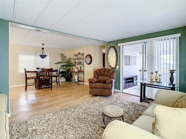 living room opens into dining room and kitchen