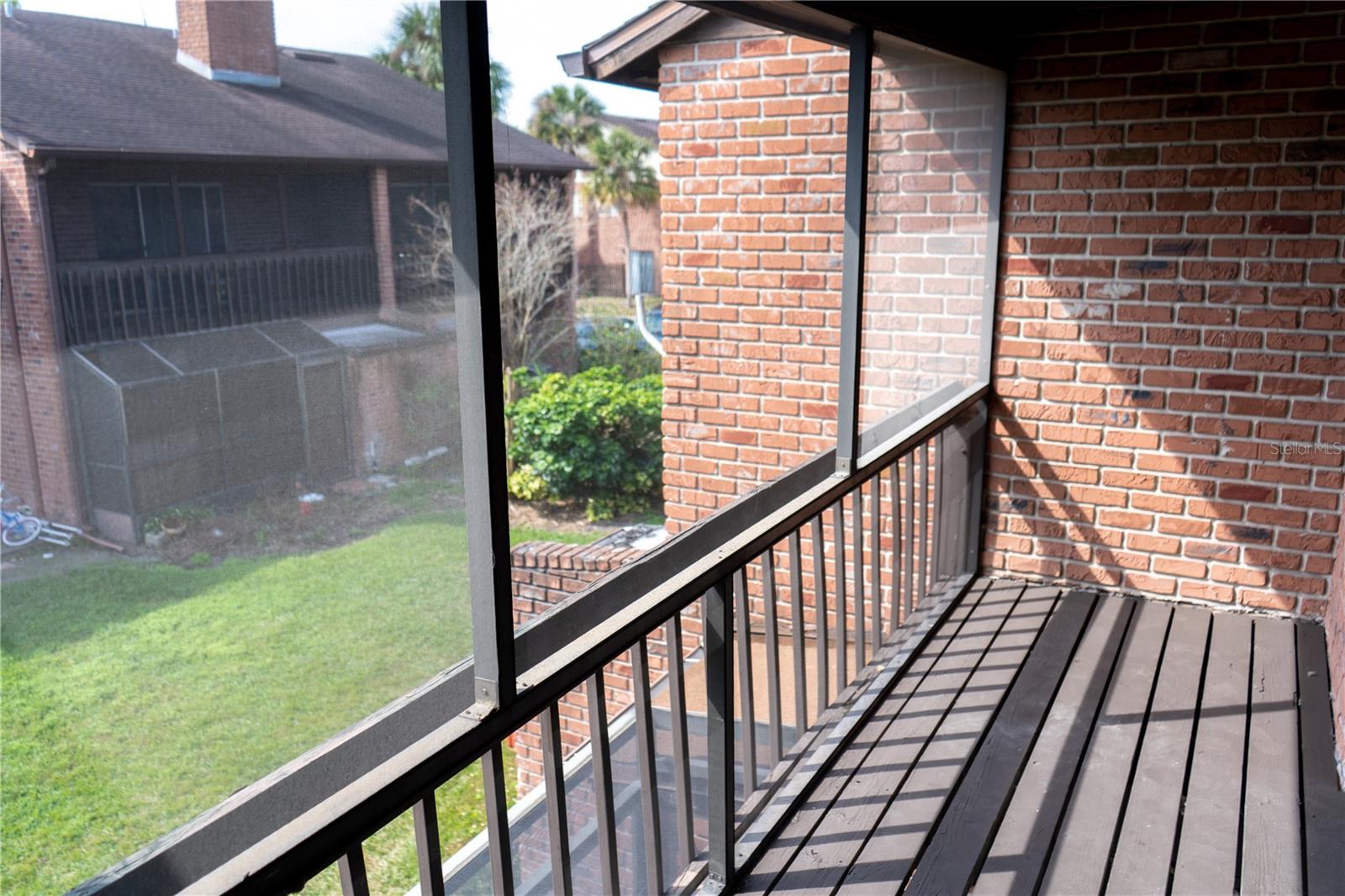 Spacious screened in balcony outside the master bedroom