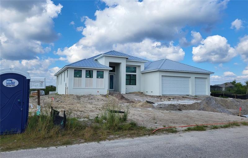 New home under construction on the adjacent lot to the right.