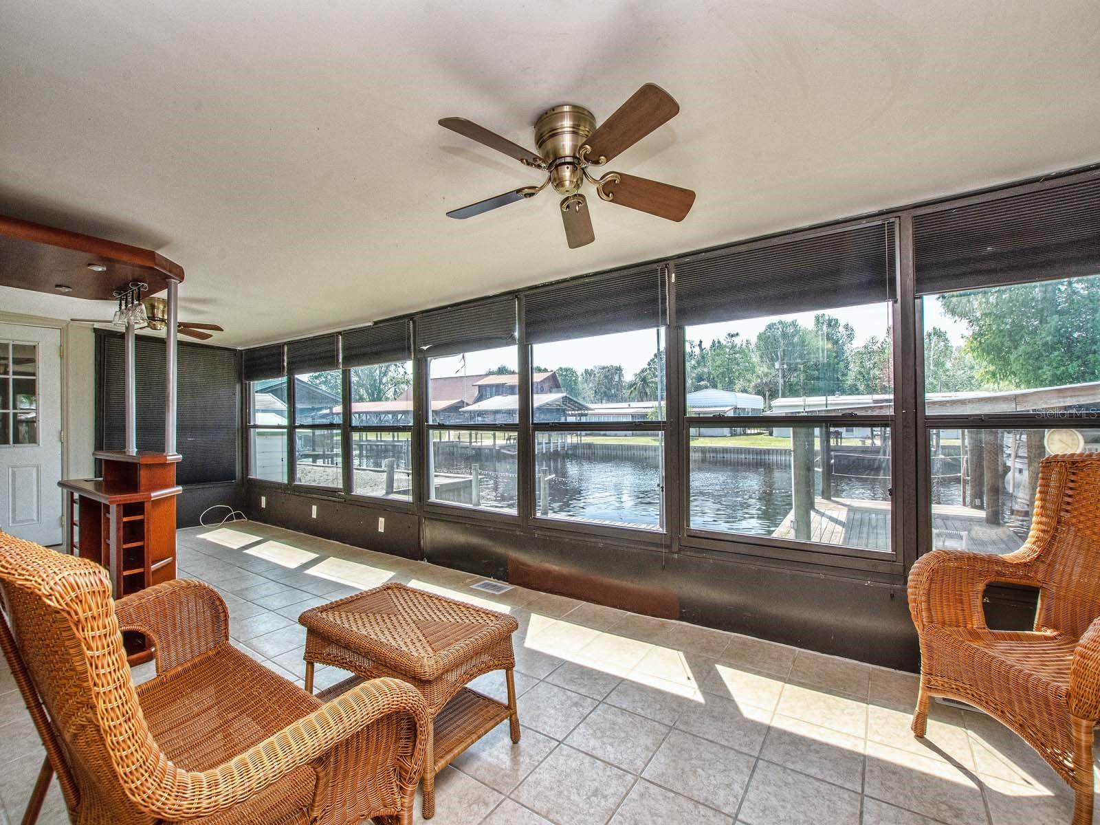 Large enclosed porch with water view