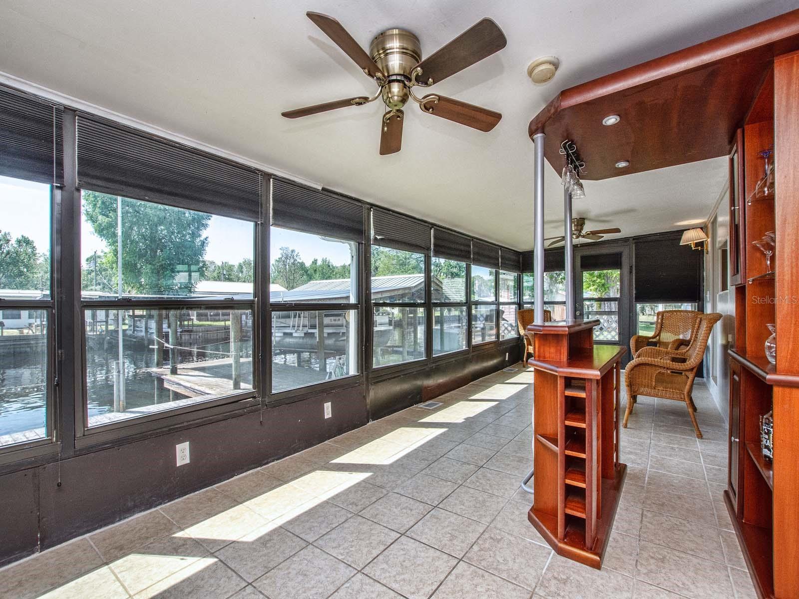 Large enclosed porch with water view