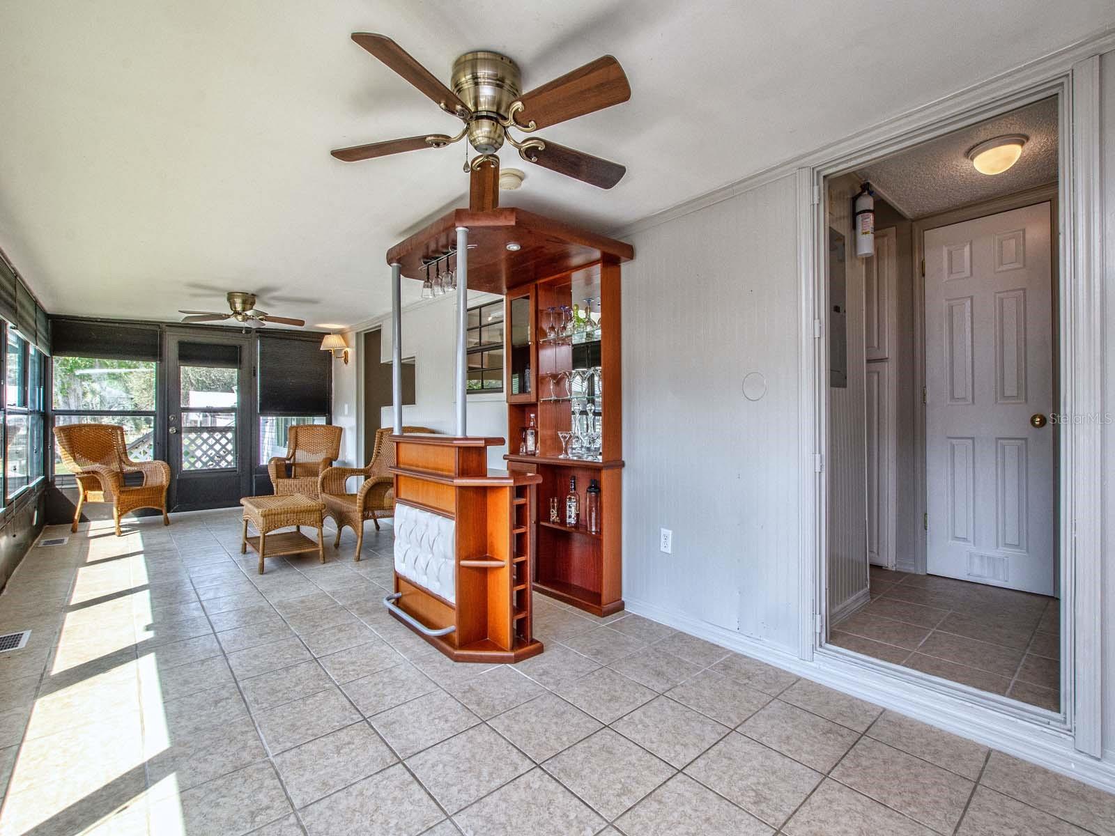Large enclosed porch with water view