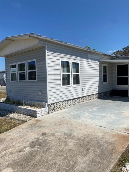Front of home with driveway and front door