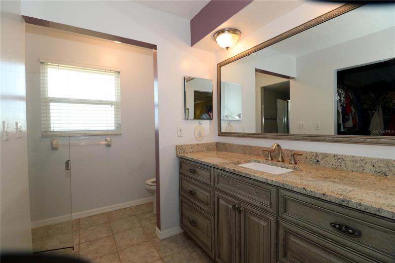 Remodeled Primary bathroom, has granite counter.