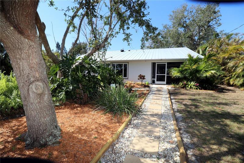 Walkway at back of home providing access to additional lot.