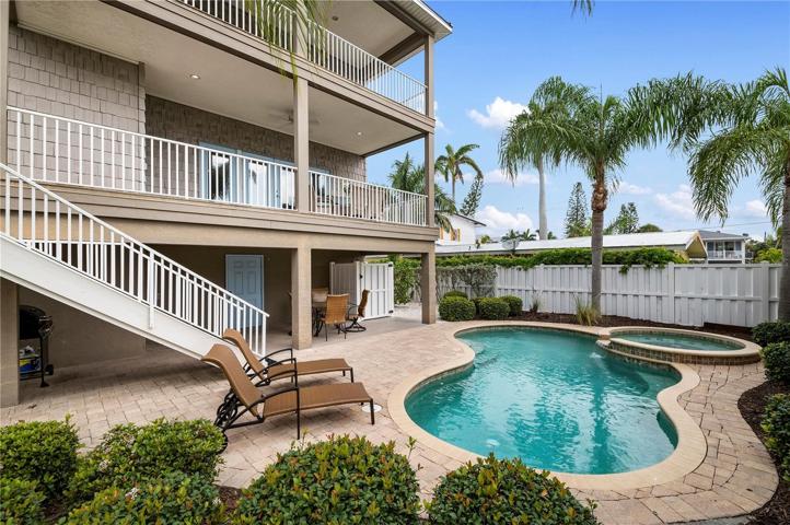 Private backyard oasis with heated pool and spa