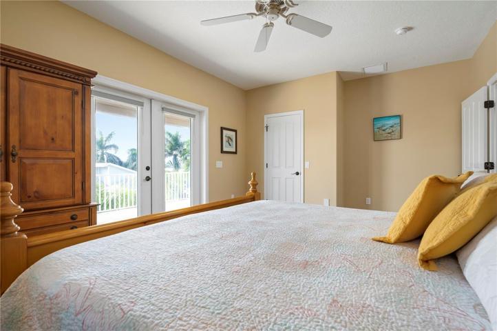 Master bedroom with doors to the patio