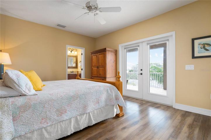 Master bedroom with doors to the patio