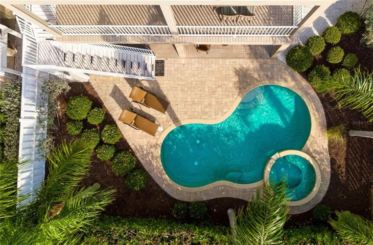 Aerial view of heated pool and spa