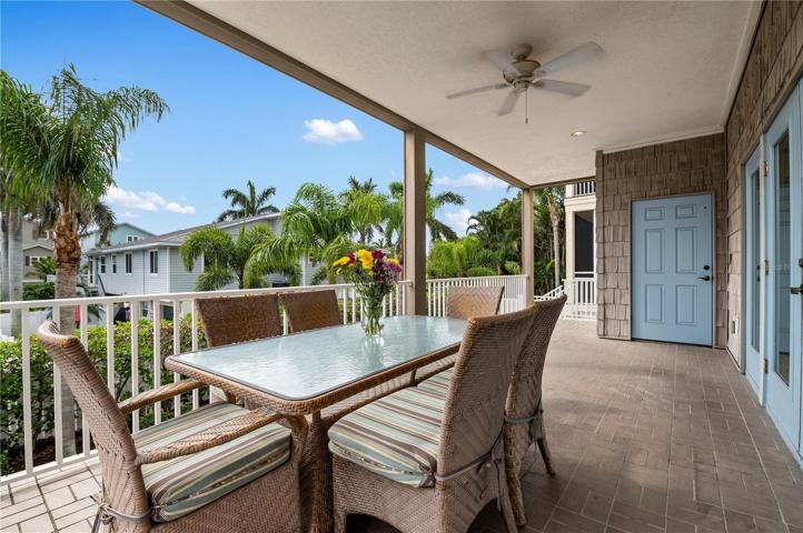 Living room with doors to the patio and elevator to all three levels
