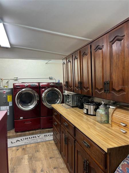 Huge laundry with extra set of cabinets