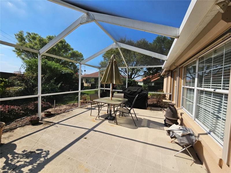 Rear Screened Porch with natural gas grill