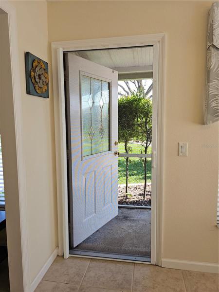 Invisible screen doors on front and back entry doors