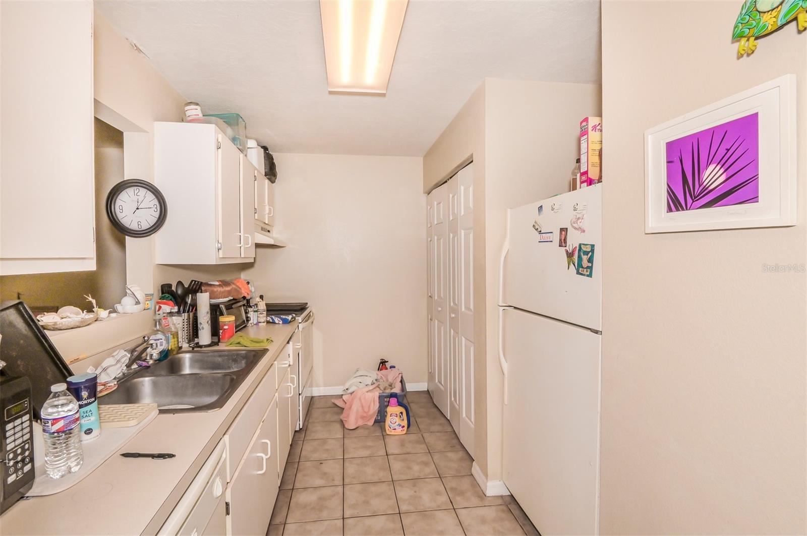 Unit #1222 Galley Kitchen With Laundry Area