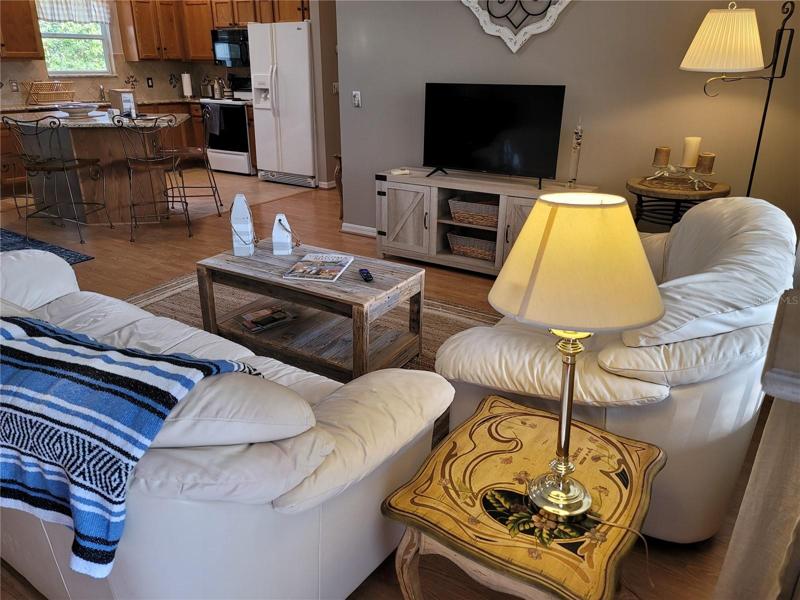 View from front door into living, dining and Kitchen.