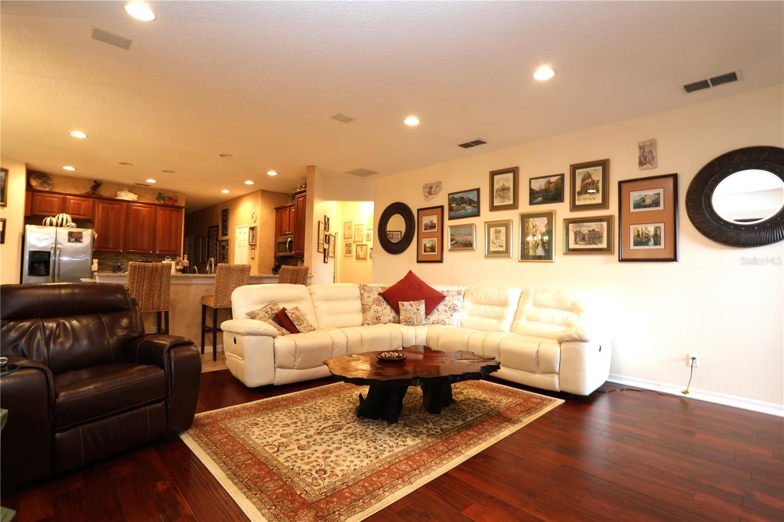 Large family room looking into the kitchen.