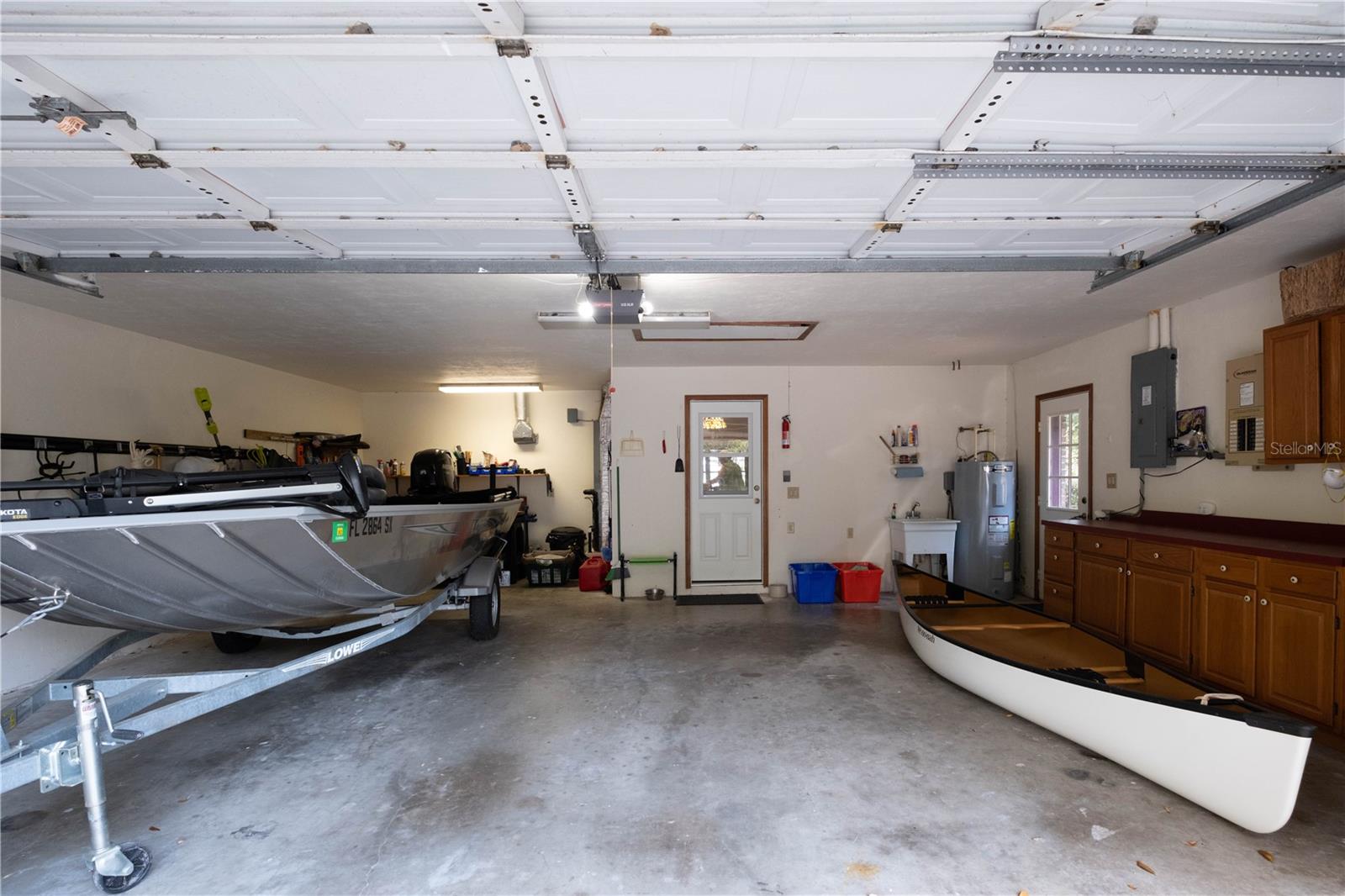 Two car garage with storage cabinets