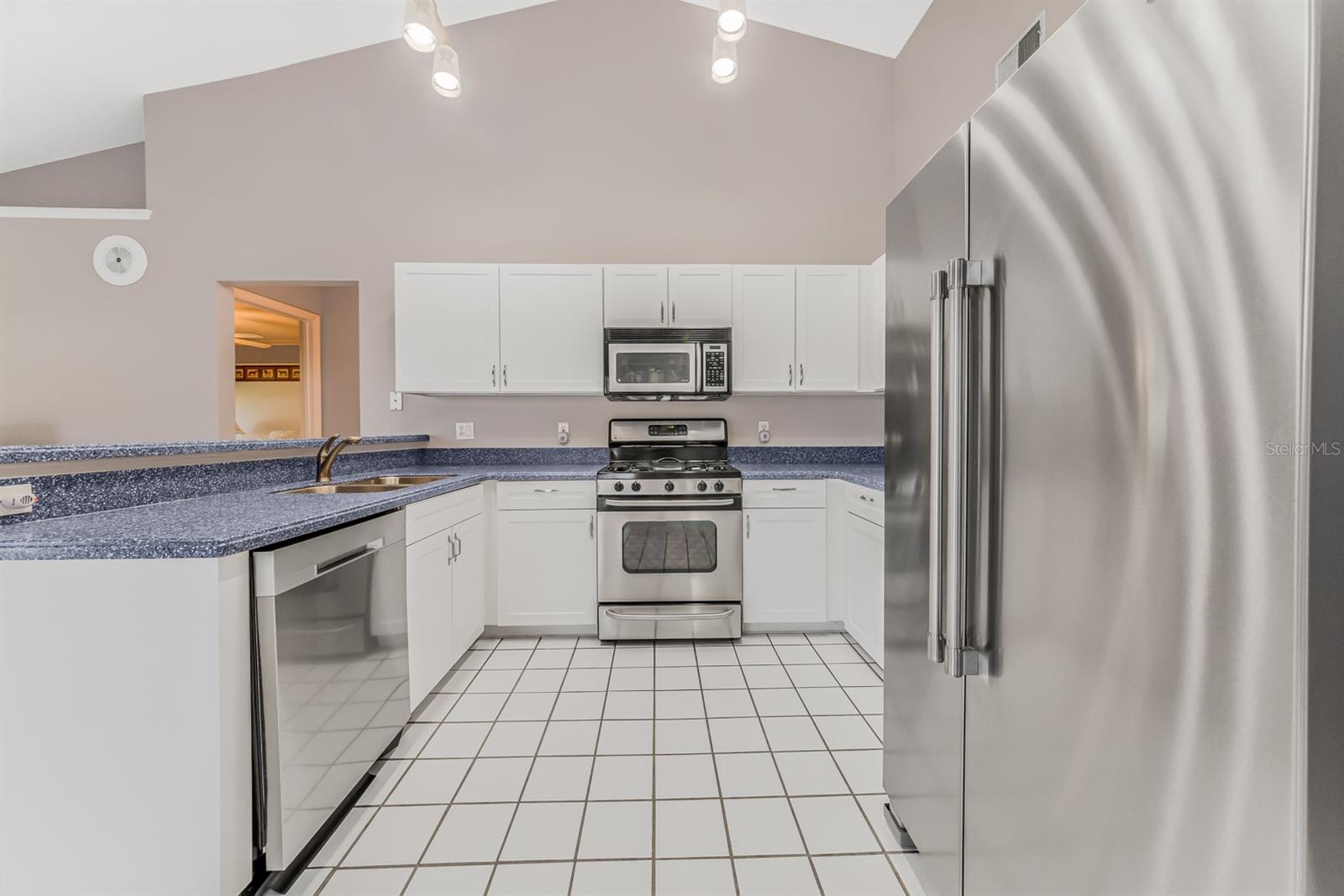 Kitchen with 2021 stainless steel fridge &amp; dishwasher