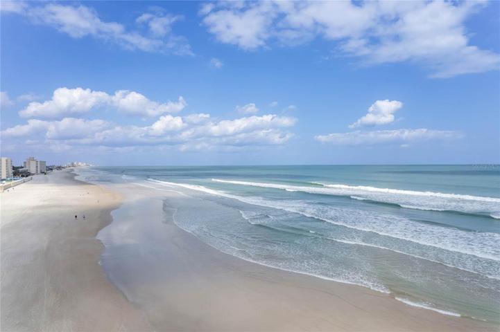 Your beach looking north. White sands, blue waters, gorgeous skies.  Daytona Beach is just the right distance away.