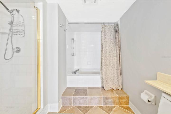 Primary suite has separate lounging tub and shower.