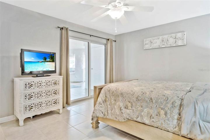 Light and Bright Second Bedroom with secondary entrance off entry lanai.
