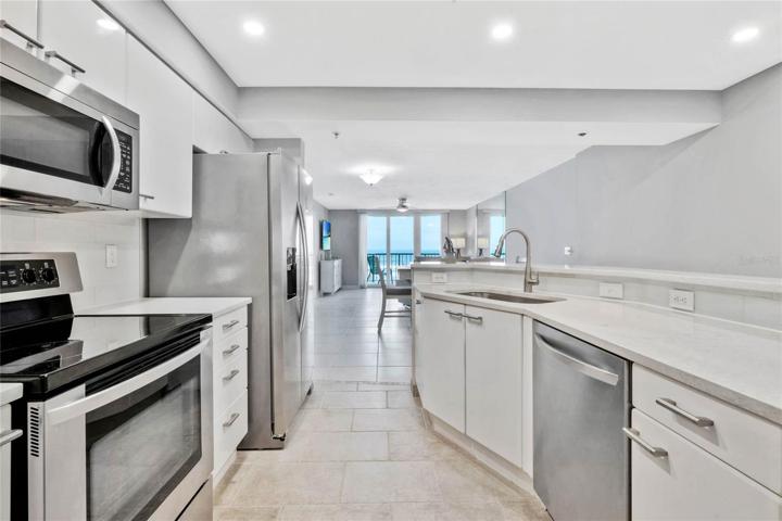 Brand new quartz counters, recessed. lighting, backsplash, faucet and sink.