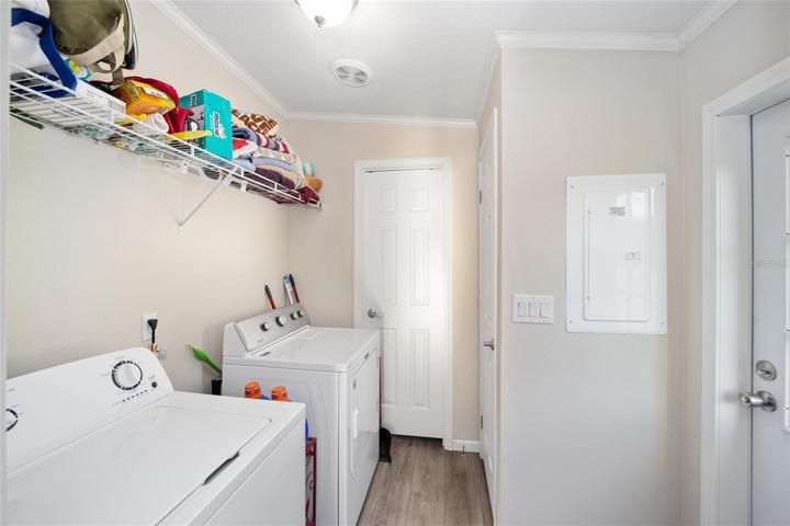 LAUNDRY ROOM WITH EXIT TO THE BACK OF THE HOUSE
