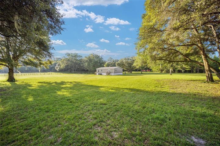 RELAXING BACK YARD JUST ADD YOUR BARN AND BACK PORCH