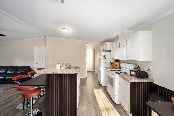 KITCHEN LEADS TO LAUNDRY ROOM