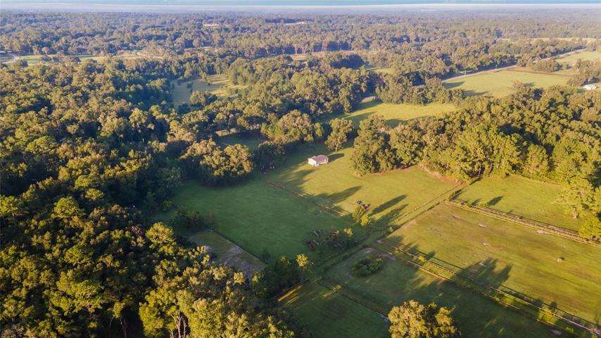 AERIAL VIEW FROM THE BACK OF PROPERTY WITH HIGHWAY 326