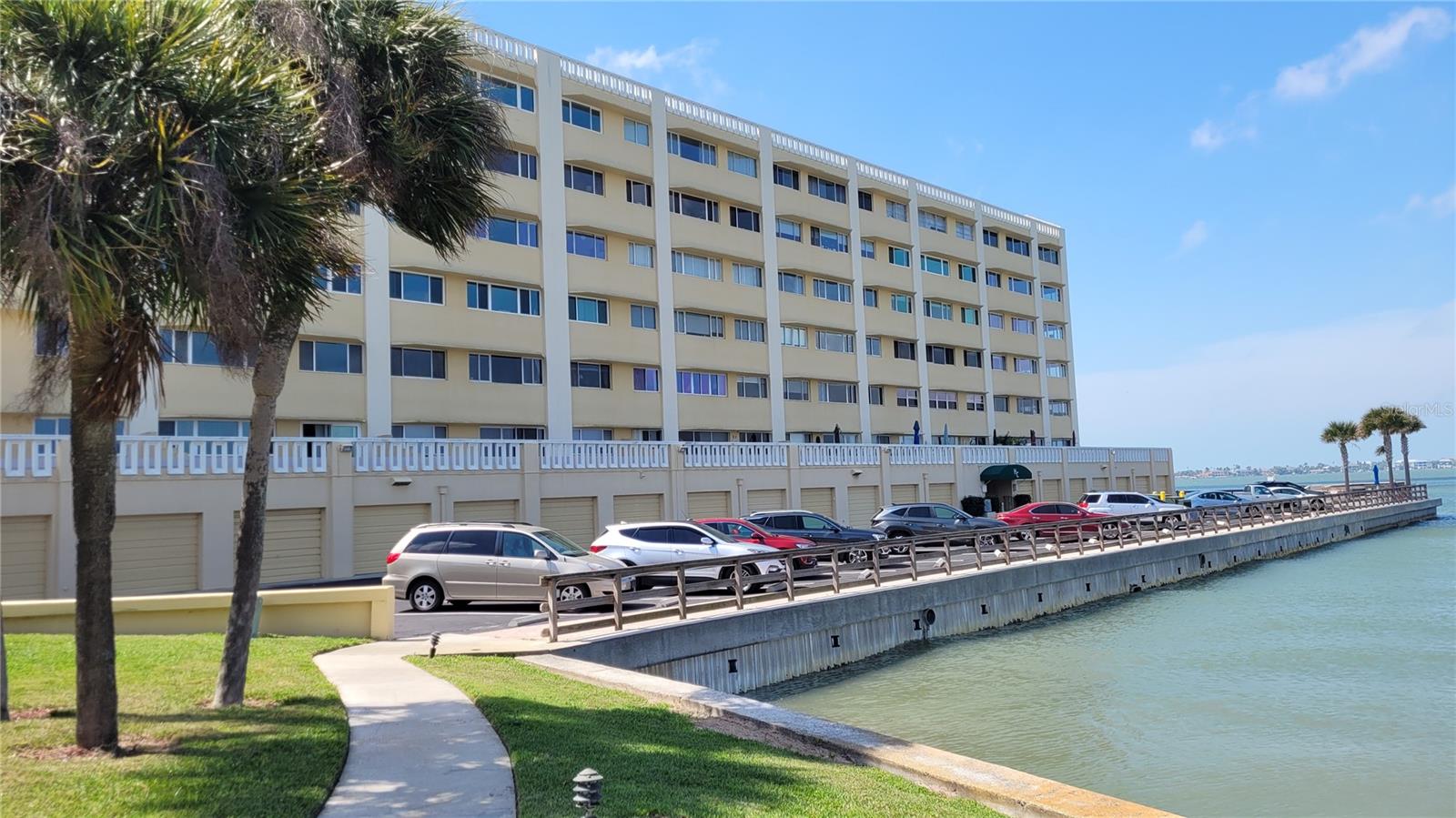 Another view of the building with guest parking in front
