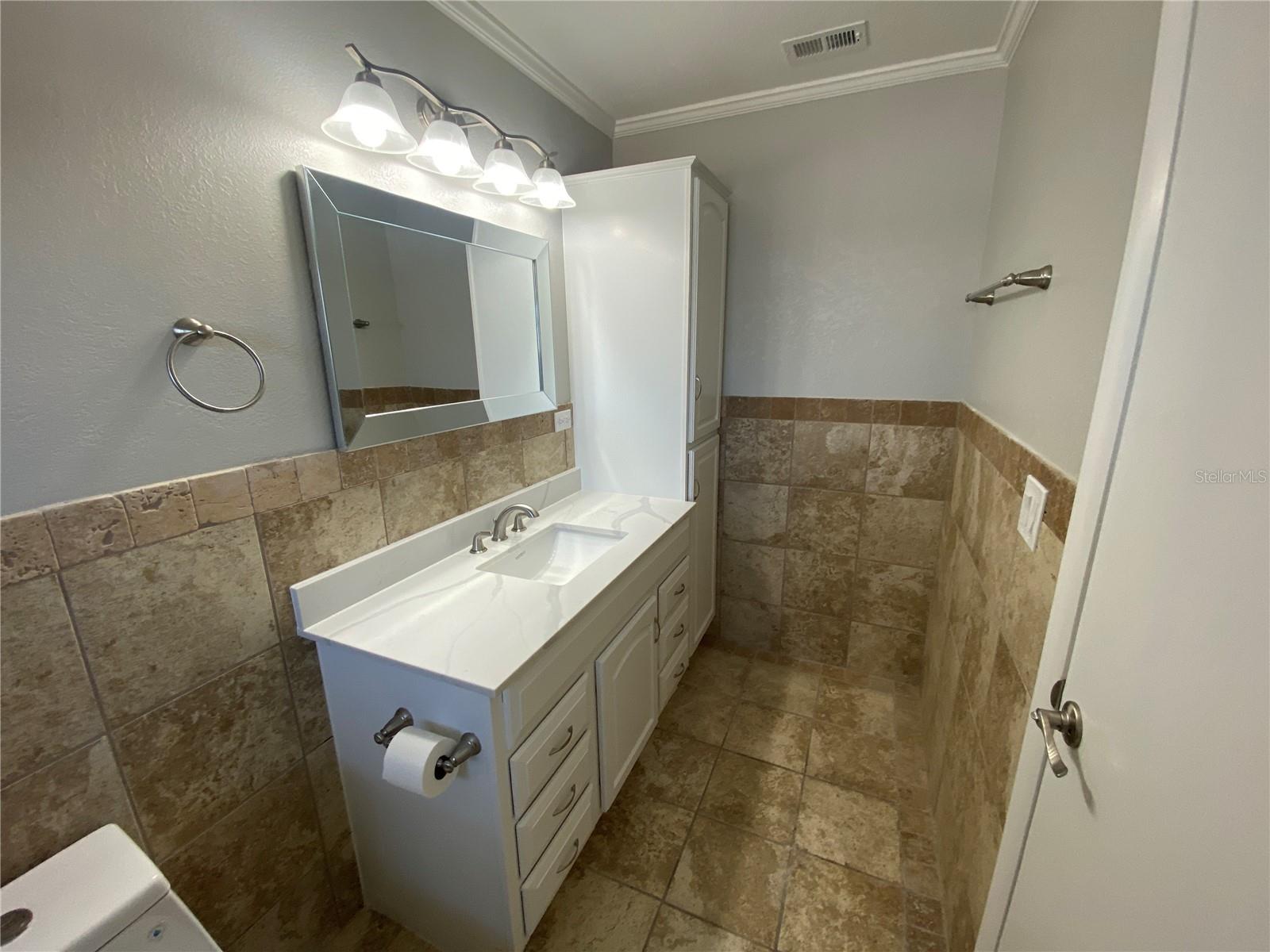 Master bath.  Note the amount of storage in the vanity and cabinet on the right.