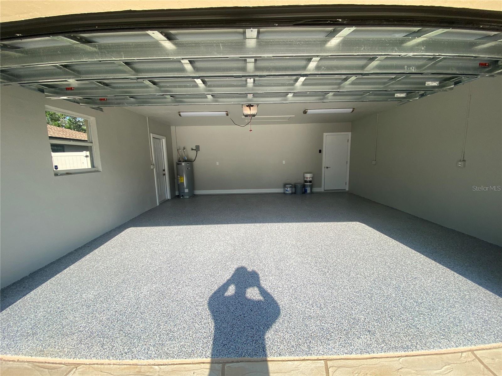 Attached garage, beautiful epoxy floor coating.