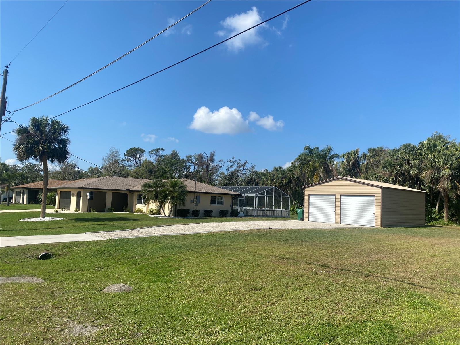 Street view showing the detached garage location.