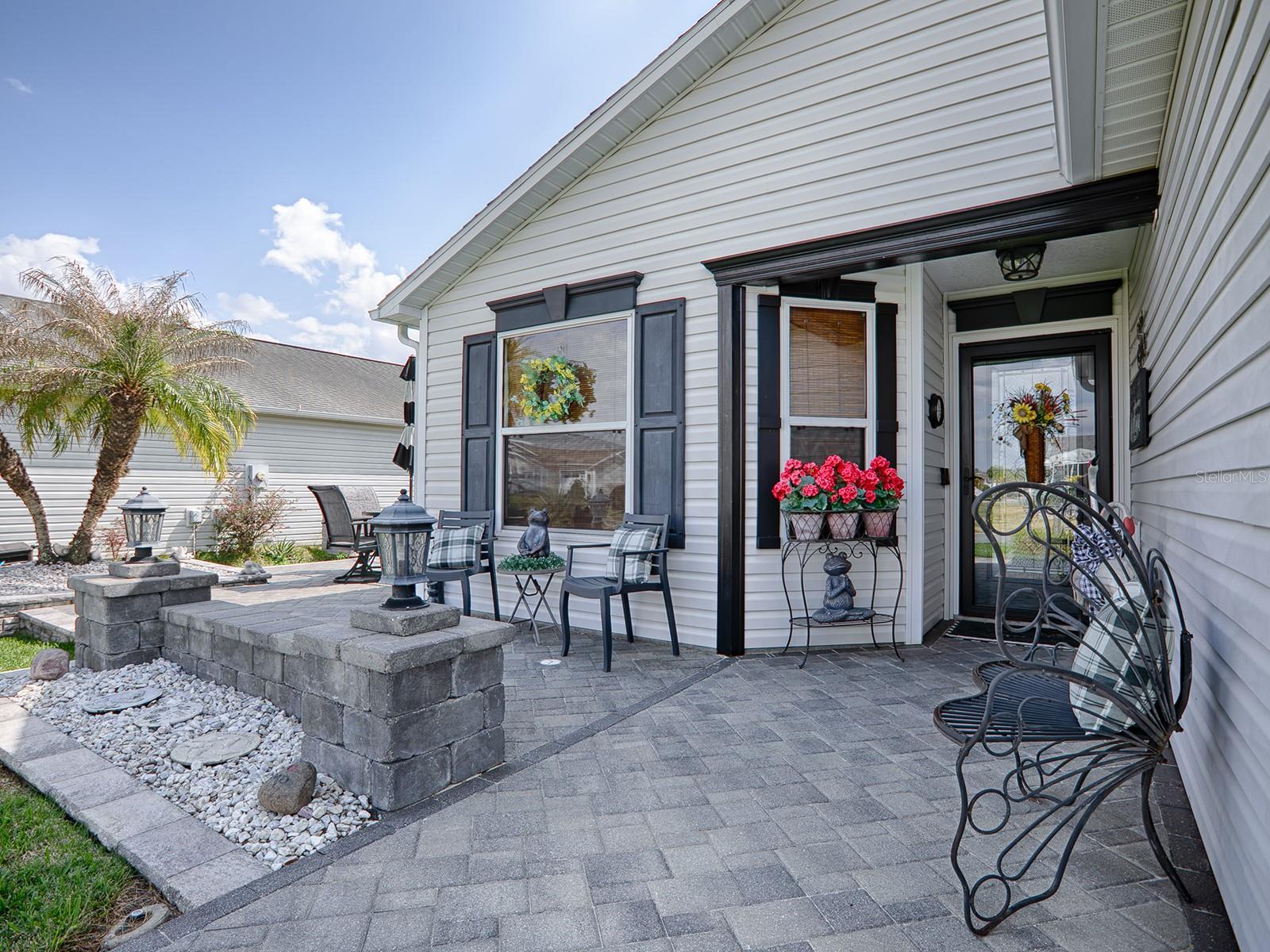 BEAUTIFUL PAVERED WALKWAY, FRONT ENTRANCE WITH SITTING AREA AND MORE...