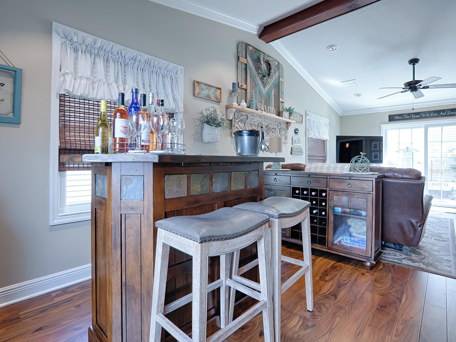 AMAZING SPACIOUS FLORIDA ROOM! NOTE THE VAULTED CEILING, MORE CROWN MOLDING AND WOOD BEAM