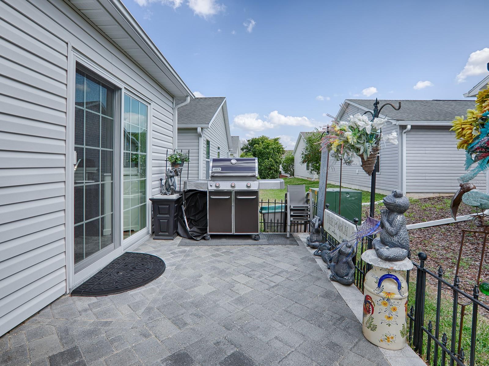 BACK PATIO WITH IRON FENCING -- PERFECT FOR OUTDOOR GRILLING!