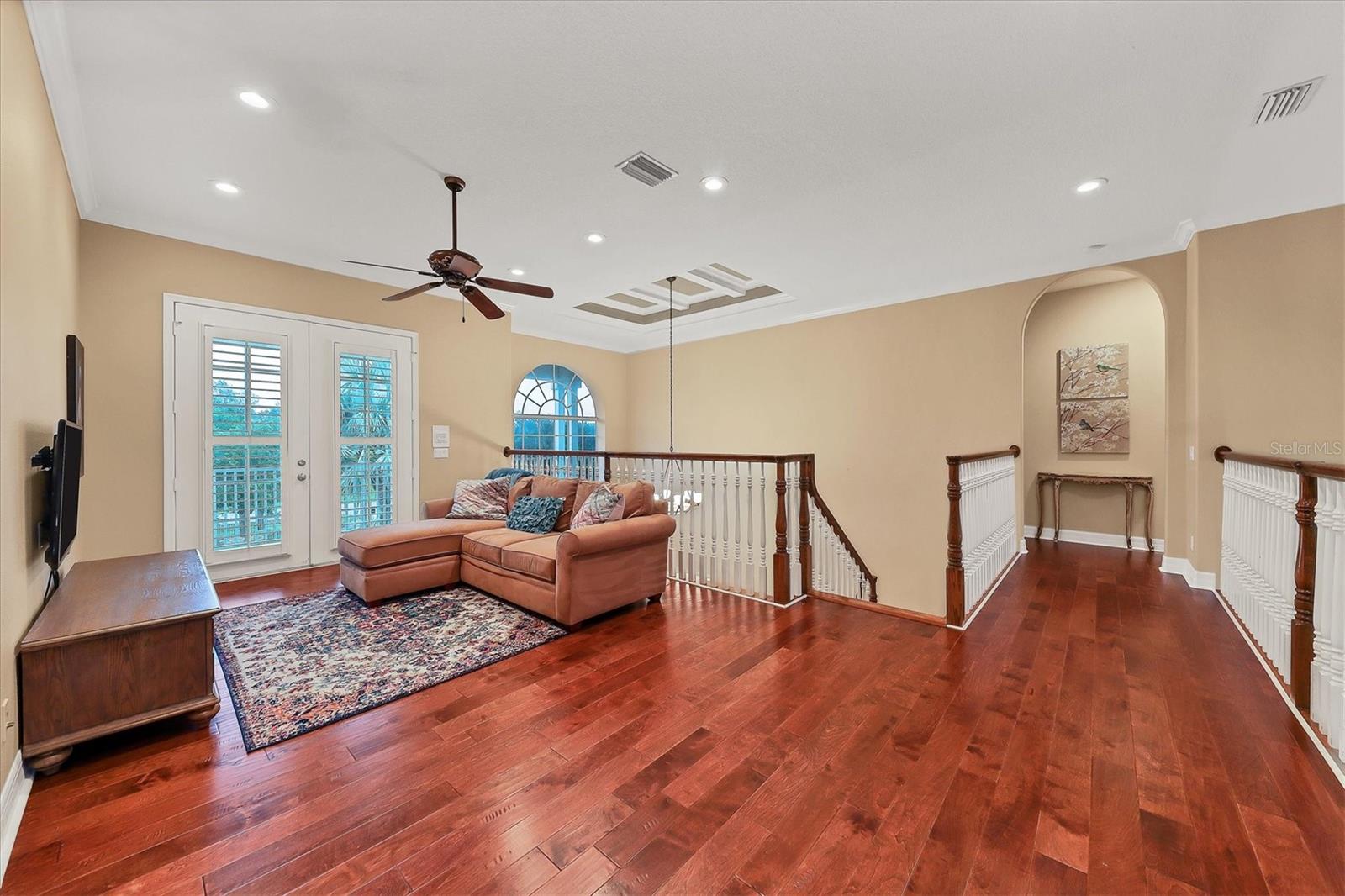 Upstairs living room with access to front porch.