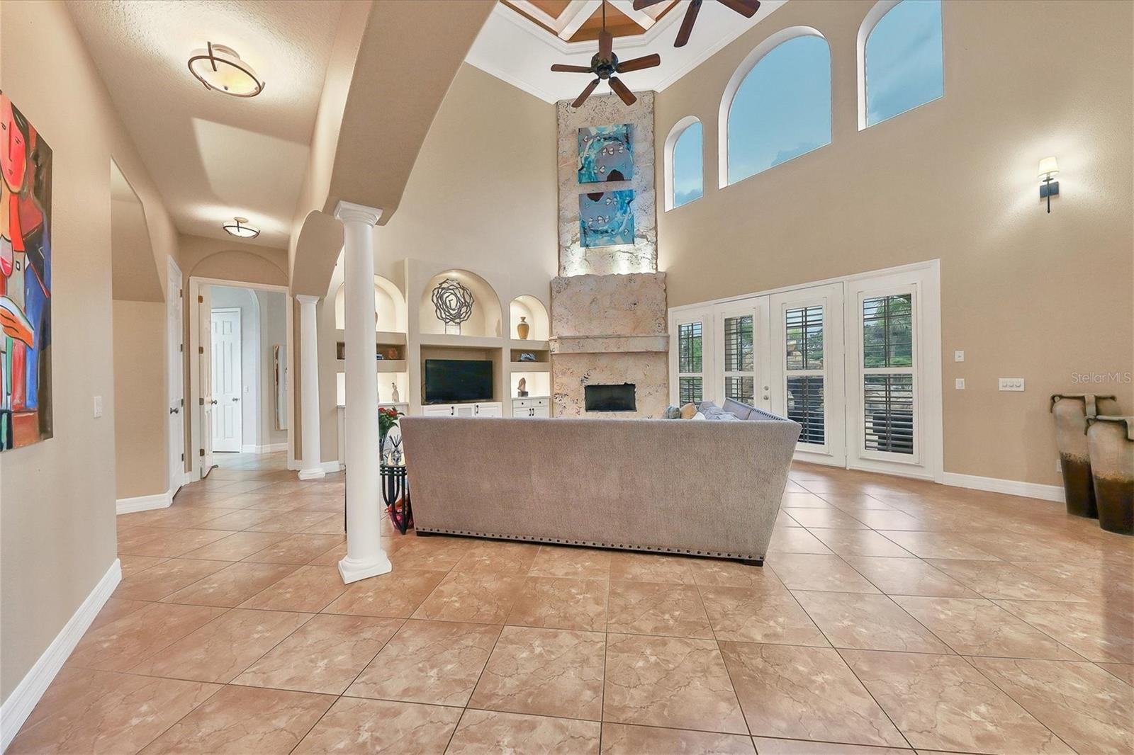 Two-story main living area with views to back yard and kitchen.