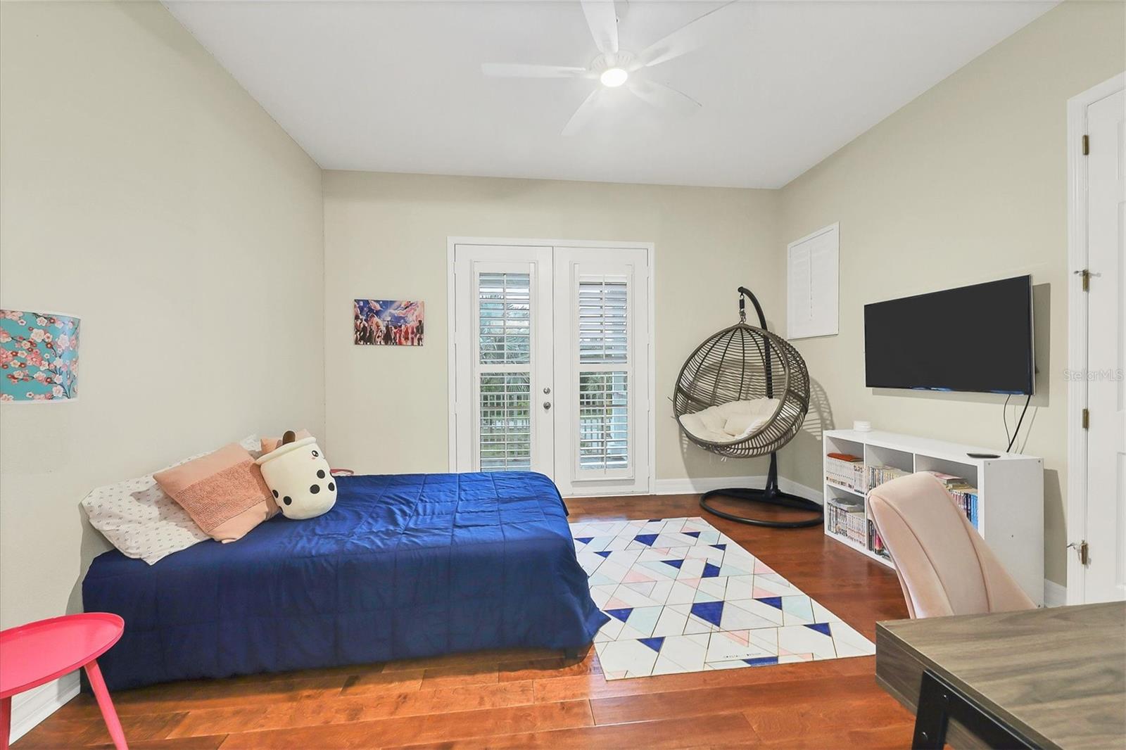 Upstairs bedroom #3 with access to front porch.